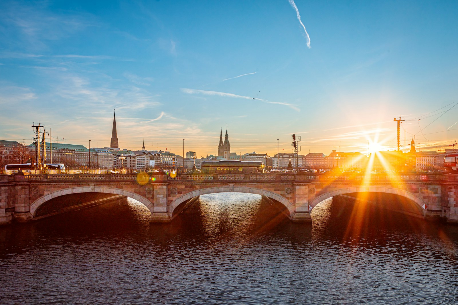 Sunset over a bridge on the Elbe in Hamburg, Germany.